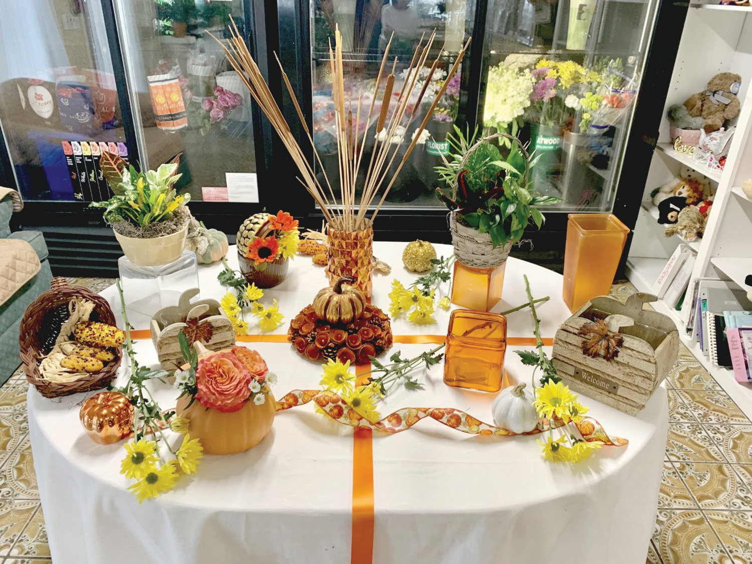Come check out this beautiful display of autumnal gift containers, each customized to fit your special occasion.  Let John Dick of Atwood Florist weave his floral magic in one of these containers (many also make festive candy dishes) ~ order your flowers today!